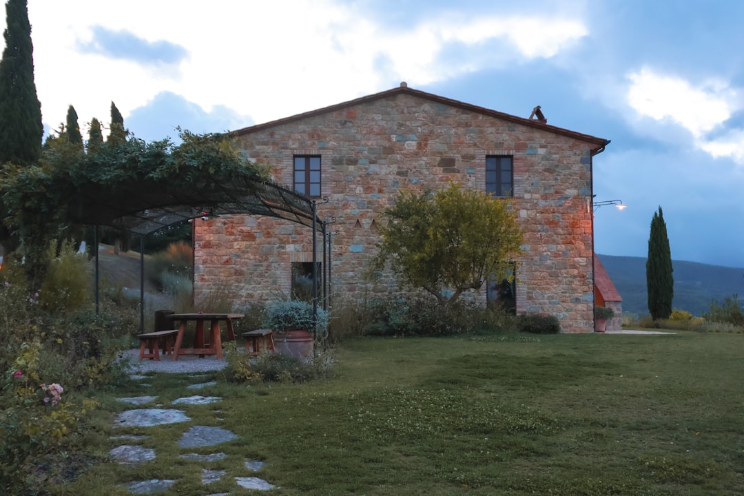 Tuscan stone villa with a stone pathway